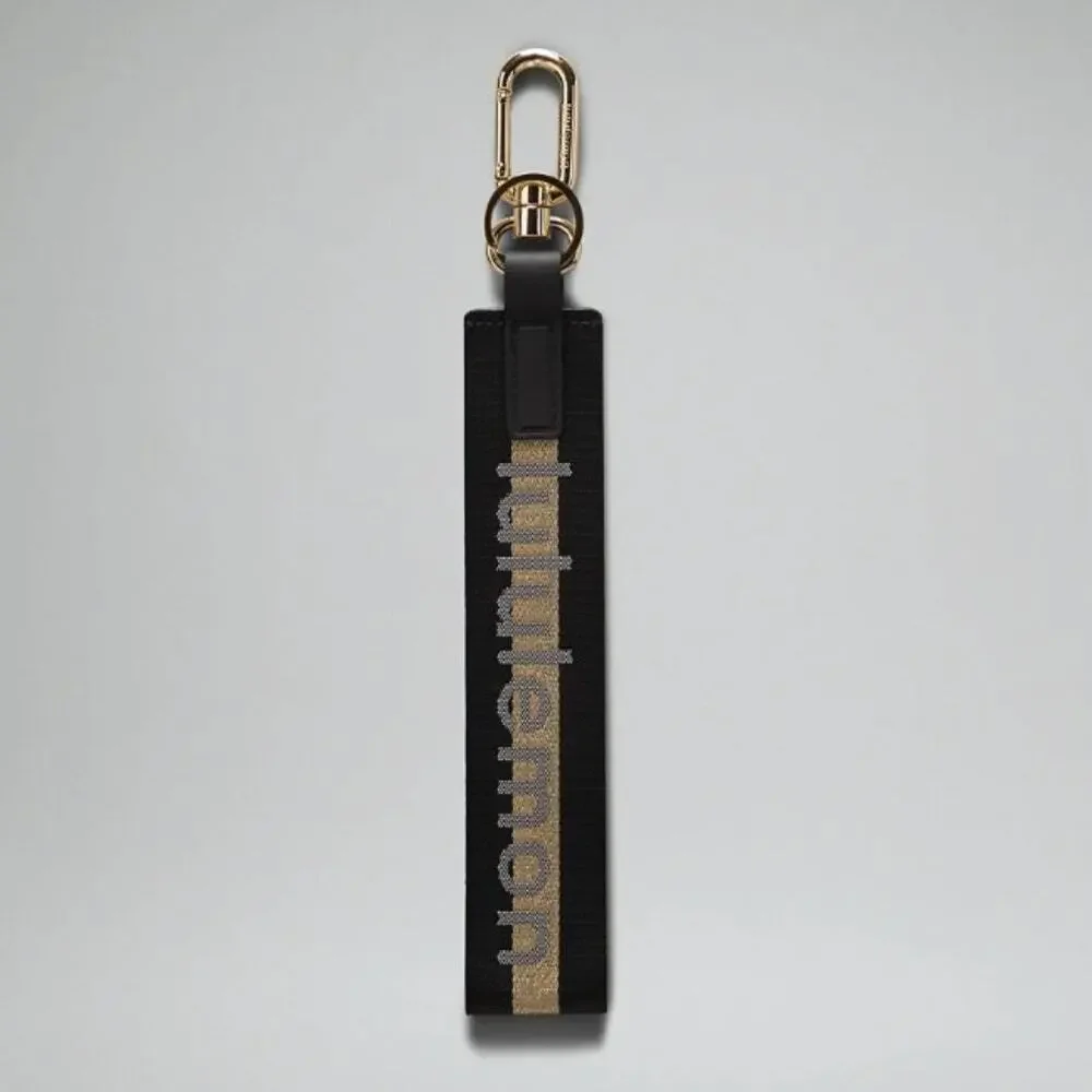 NEW Lululemon Never lost Keychain Wordmark Black and Gold